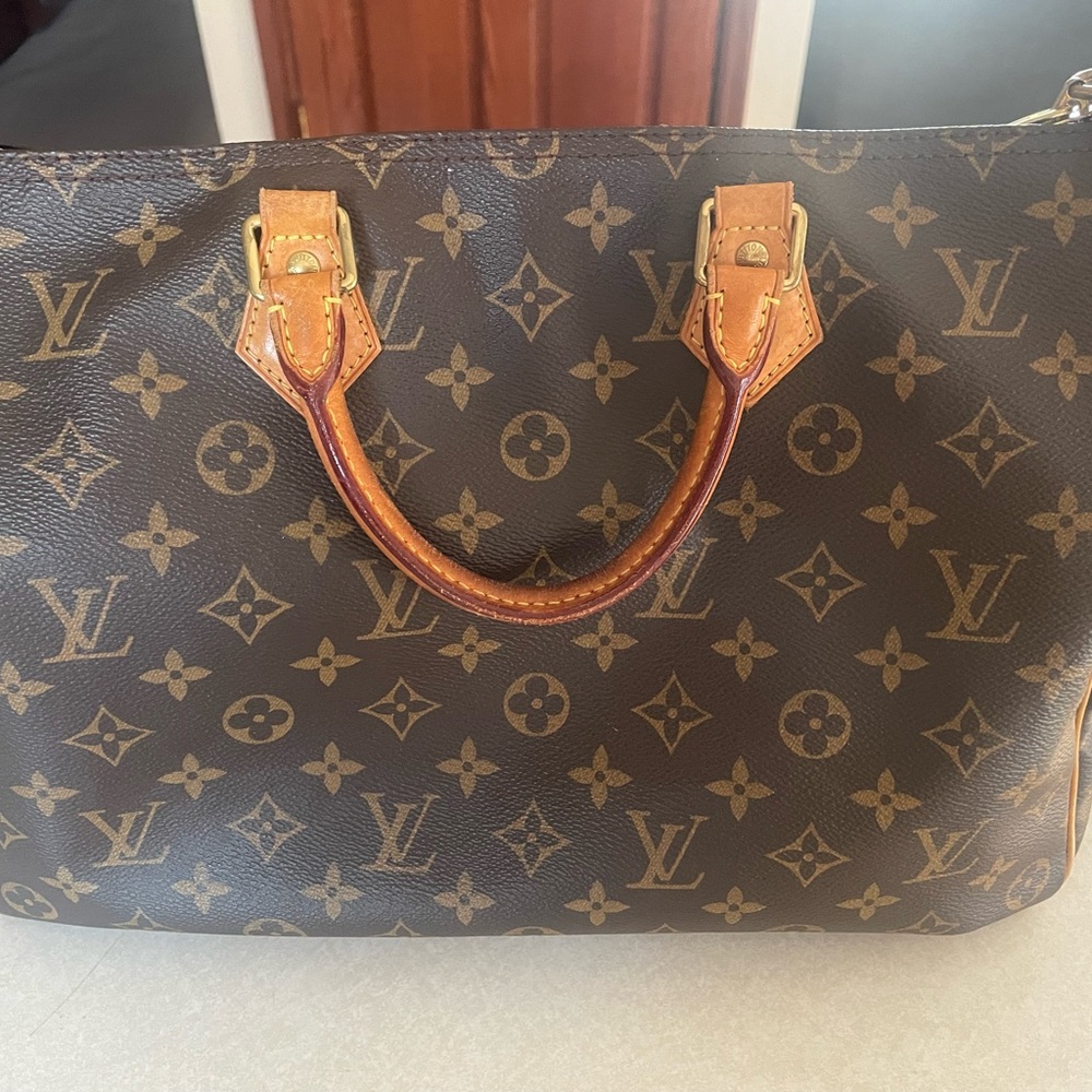 Authentic Louis Vuitton Speedy Bandouliere 35 in Monogram Coated Canvas